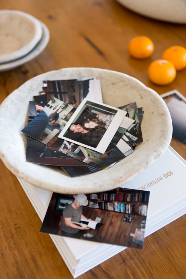 Fill a bowl with polaroids on your coffee table