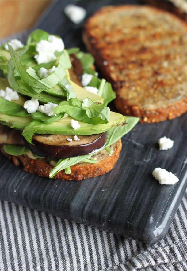 Veggie Sandwich with Hummus, Arugula, Grilled Eggplant, Avocado, Basil and Goat Cheese Crumbles on Toasted Seeduction Bread