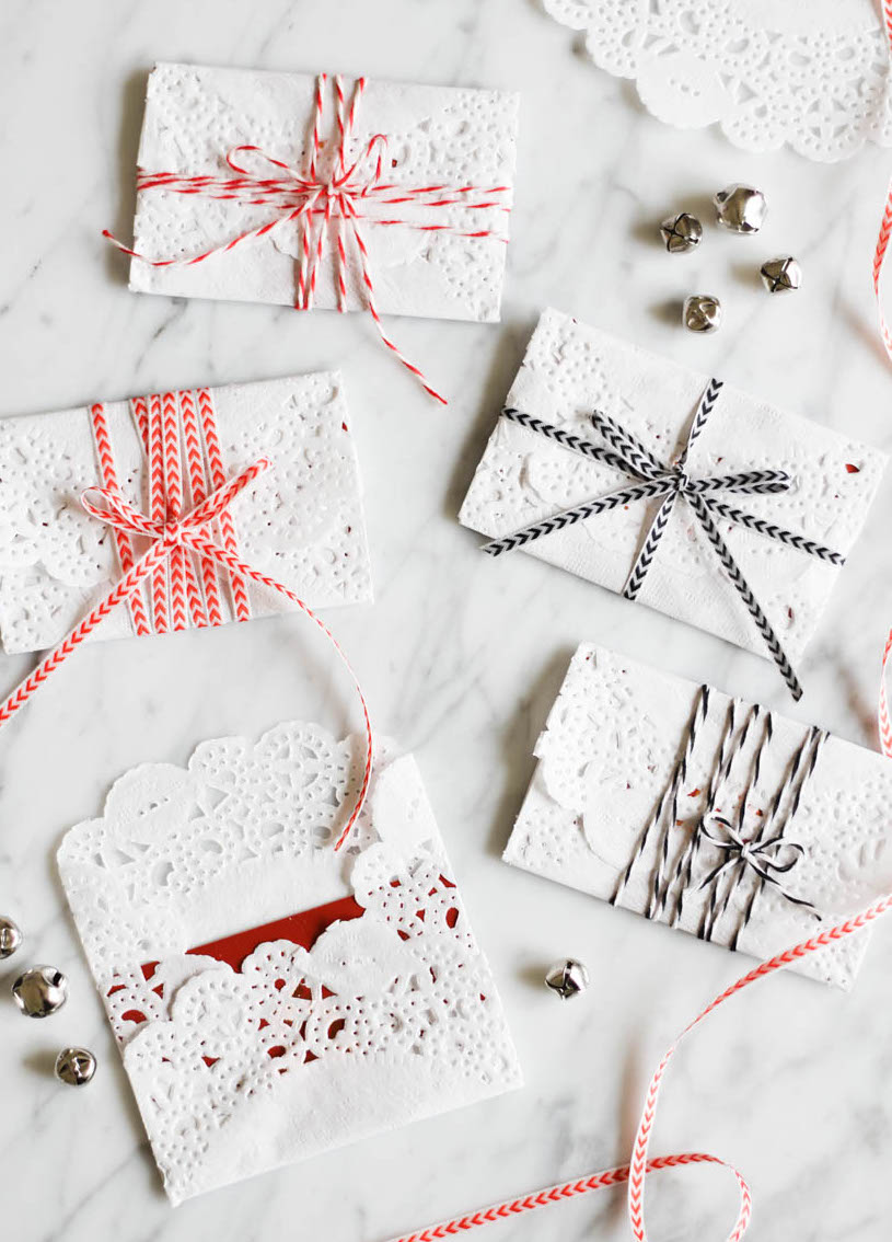 Wrap gift cards with paper doilies and ribbon