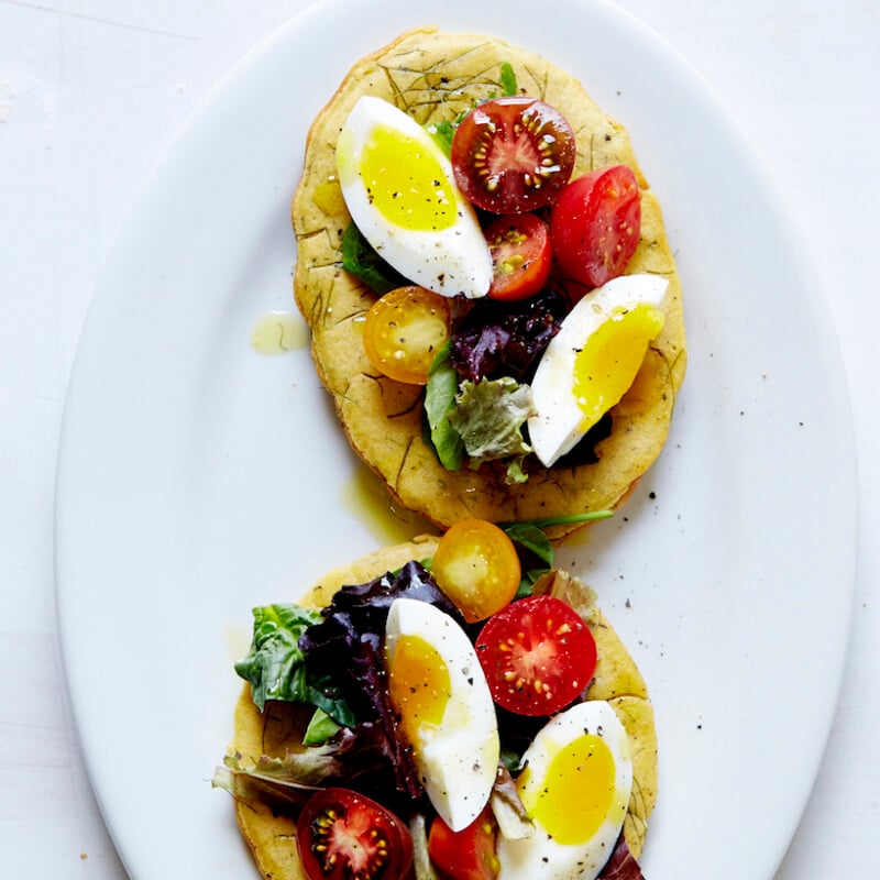 Chickpea Socca with Cherry Tomato, Soft-Boiled Egg, & Mesculin Greens