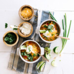 Slow Cooker White Bean Chicken Chili // super easy & healthy weeknight meal. Everything goes in the slow-cooker at the same time, and it's ready to go hours later!