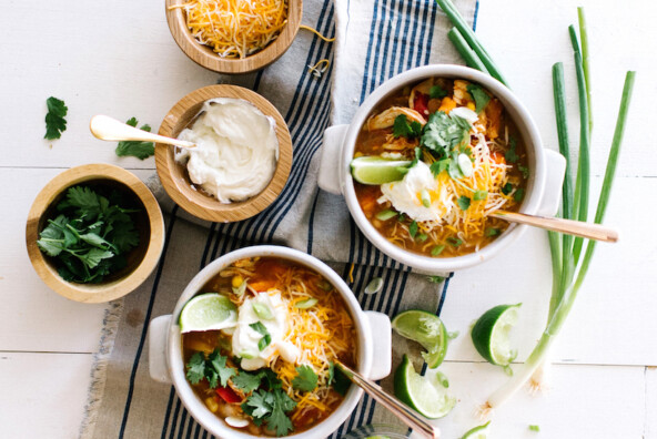 Slow Cooker White Bean Chicken Chili // super easy & healthy weeknight meal. Everything goes in the slow-cooker at the same time, and it's ready to go hours later!