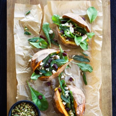 savory stuffed sweet potatoes on baking sheet
