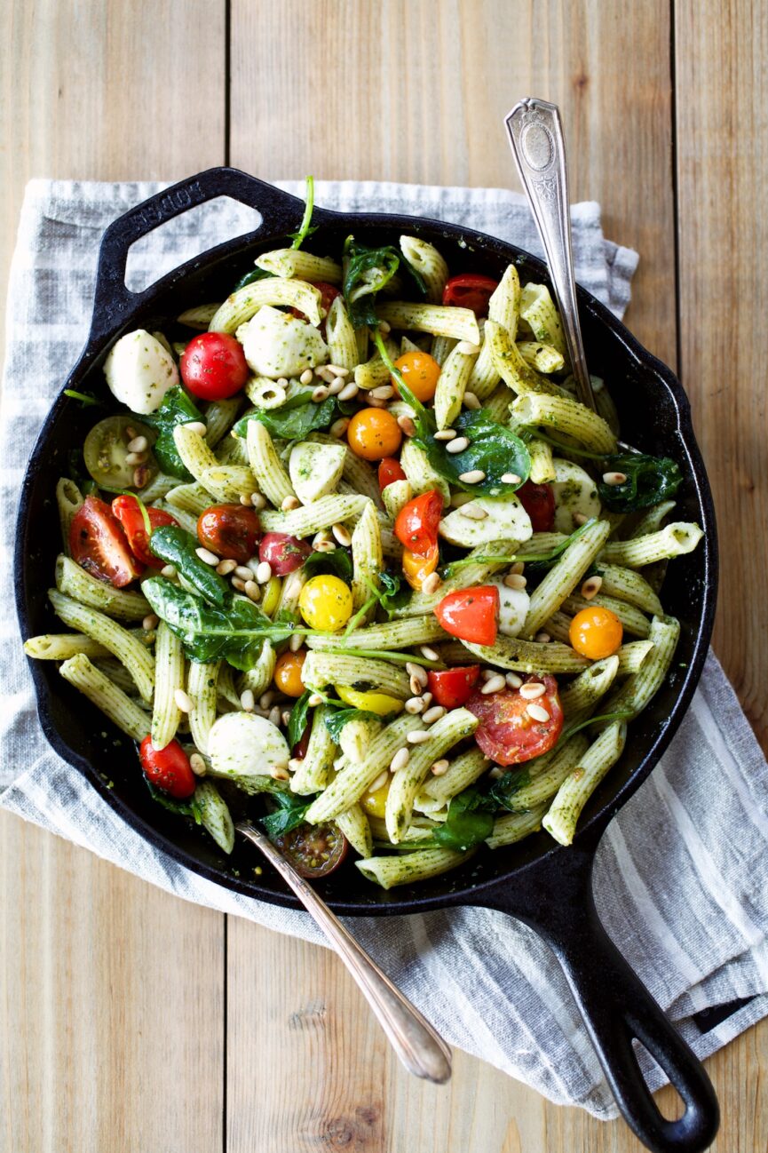 caprese pesto pasta in cast iron skillet