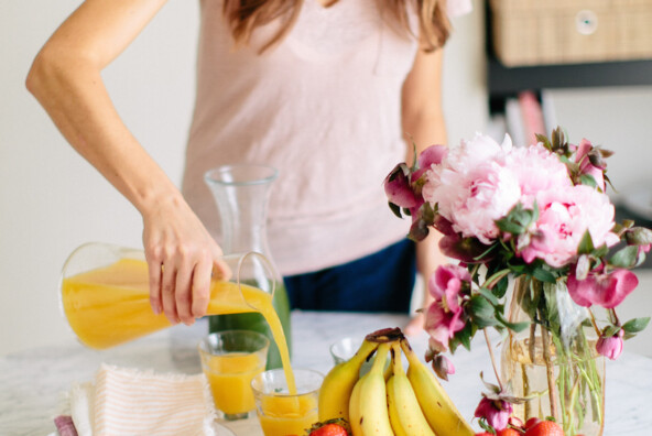 Love the idea of mixing fruits and flowers for a cute brunch tablescape.