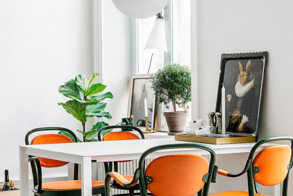 swedish dining room - love the bright pop of orange!