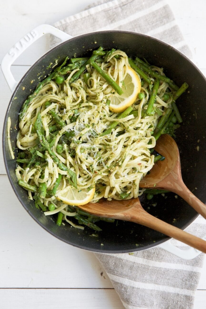 almond mint pesto pasta in mixing bowl