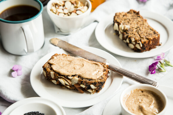 Treat yourself with this black sesame banana bread -- the tahini almond butter topping is to-die-for!