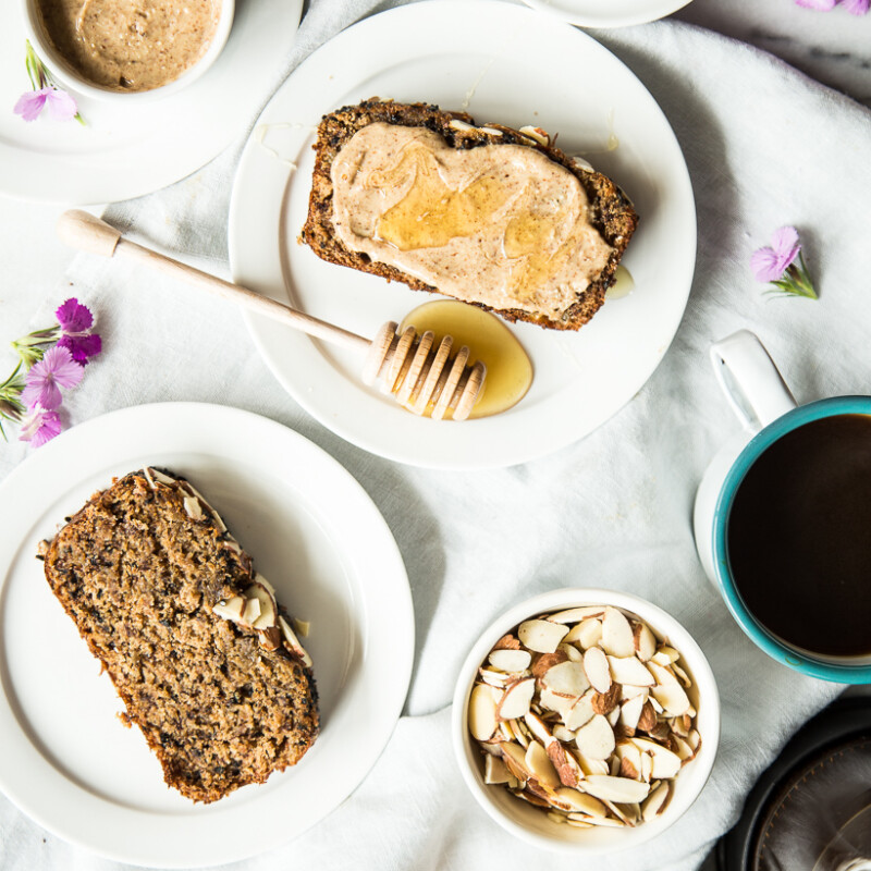 Treat yourself with this black sesame banana bread -- the tahini almond butter topping is to-die-for!