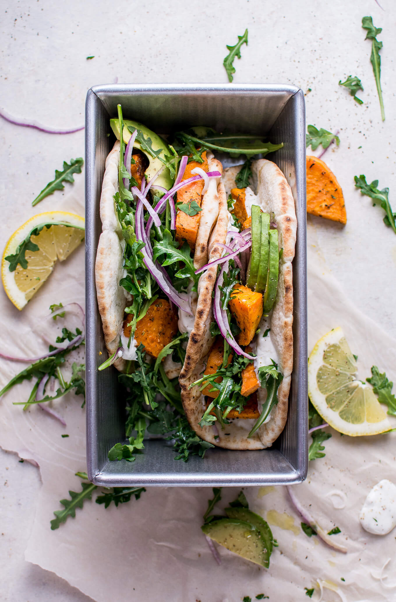 sweet potato pitas with arugula & garlic dressing