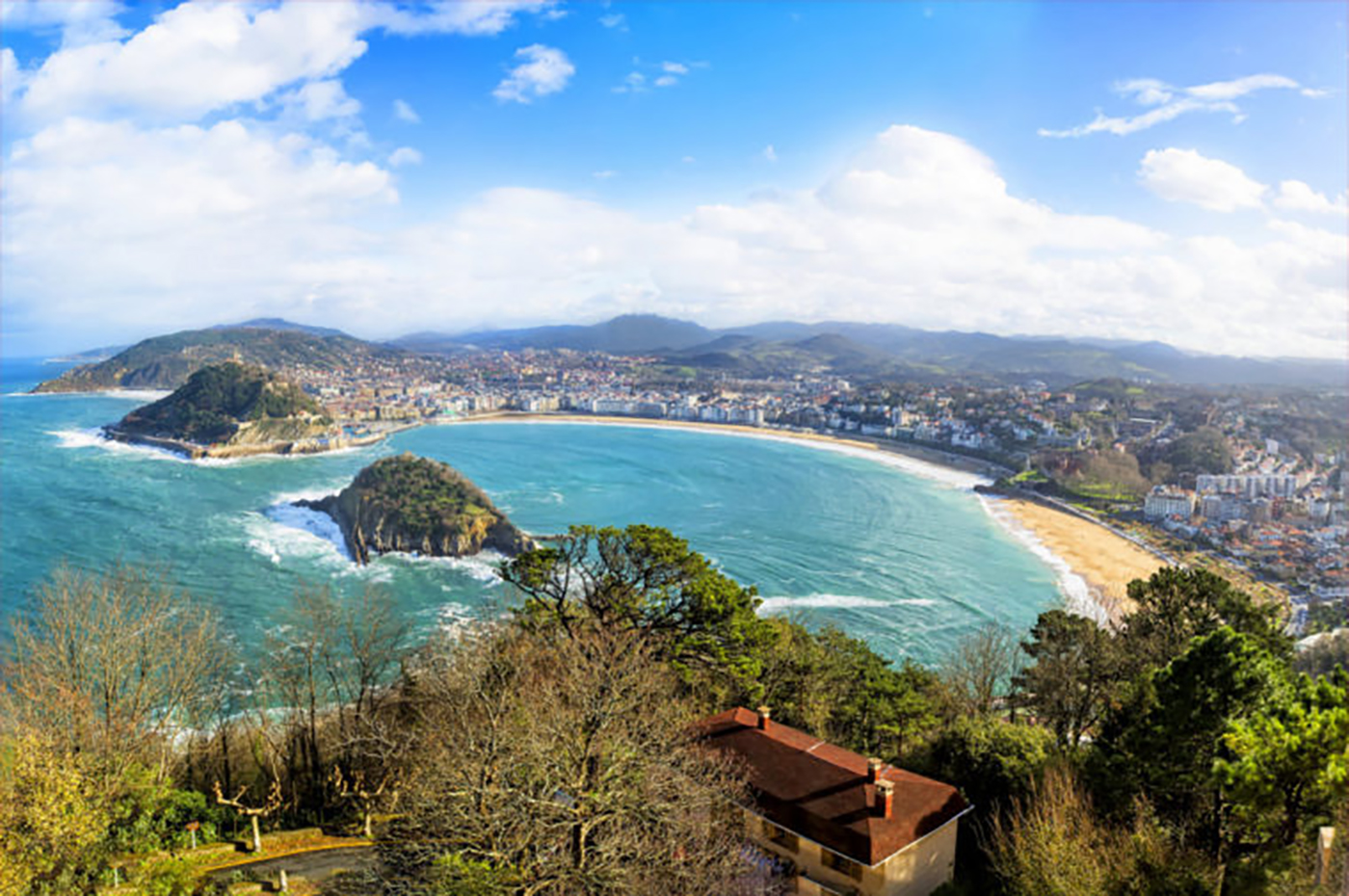 San Sebastian, Spain "Ever since reading The Sun Also Rises in high school, Hemingway’s retreat to San Sebastian has always been a dream of mine. In addition to laying on the beach with a stack of (Hemingway) novels, I’d sip cortados, soak up the architecture, and hop from one pintxo bar to the next, eating all the octopus, jamon, and crusty grilled bread in site." -- Camille Styles