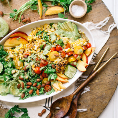 This southwestern superfood salad is bursting with tomatoes, peaches, and all my other favorite flavors of summer!