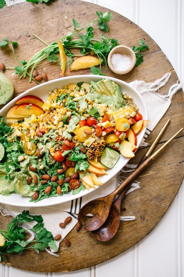 This southwestern superfood salad is bursting with tomatoes, peaches, and all my other favorite flavors of summer!