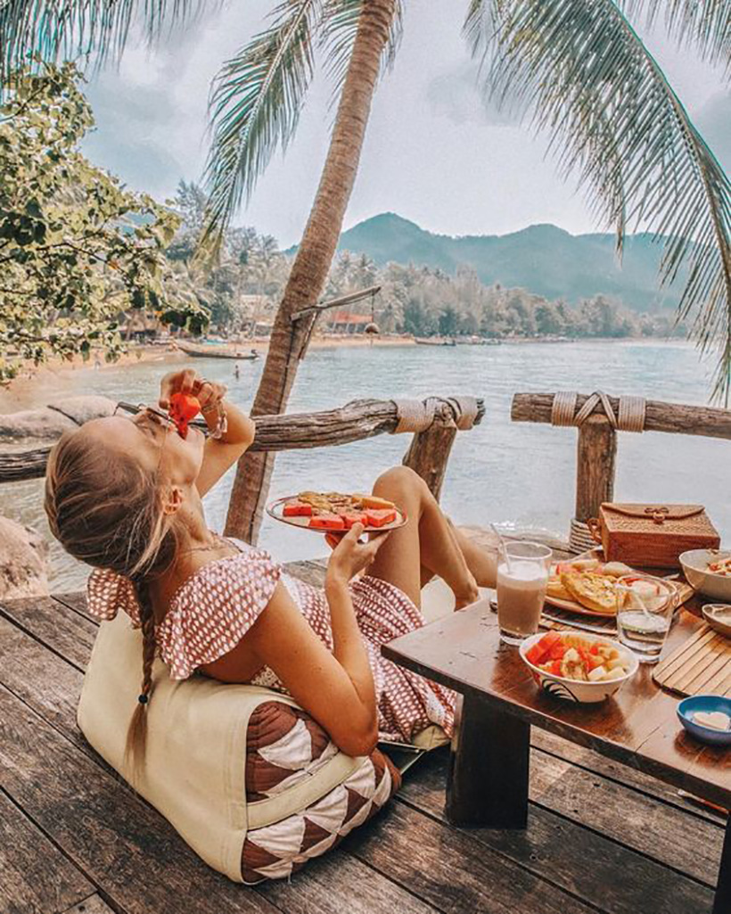 eating pizza on the beach