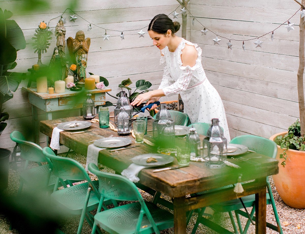 Chanel Dror setting the table at the CS Bungalow in Austin, Texas.