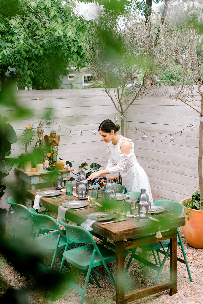 Chanel Dror setting the table at the CS Bungalow in Austin, Texas.