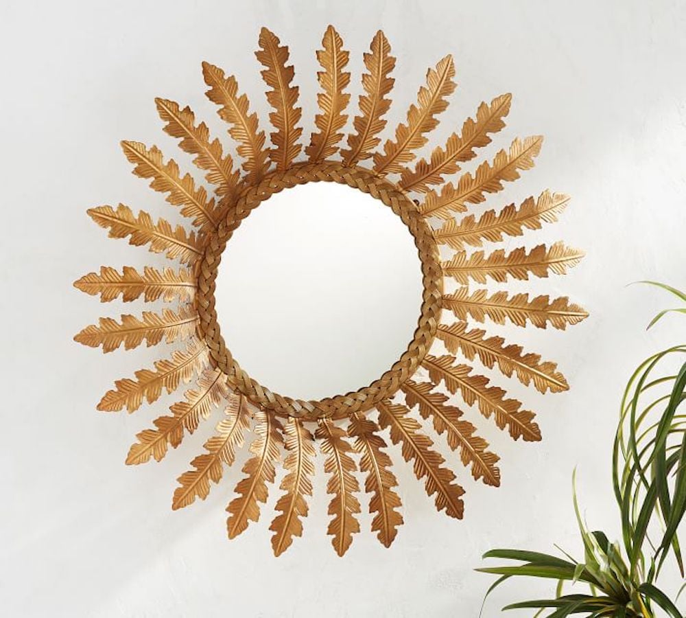 round sunburst style wall mirror in gold