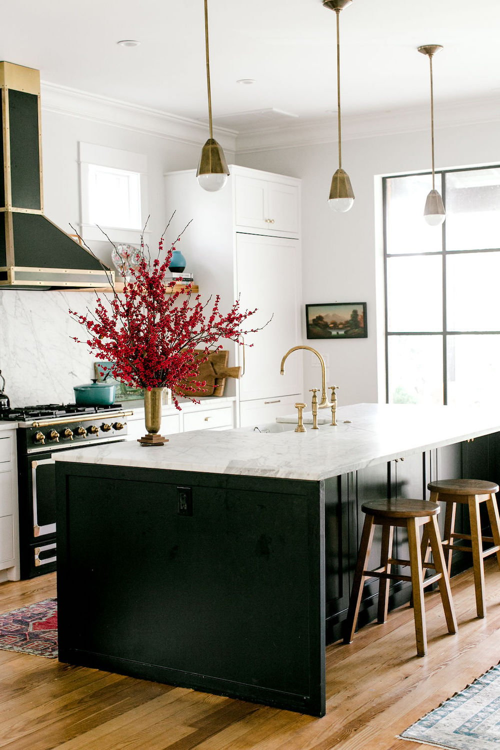 modern kitchen with marble and brass hardware