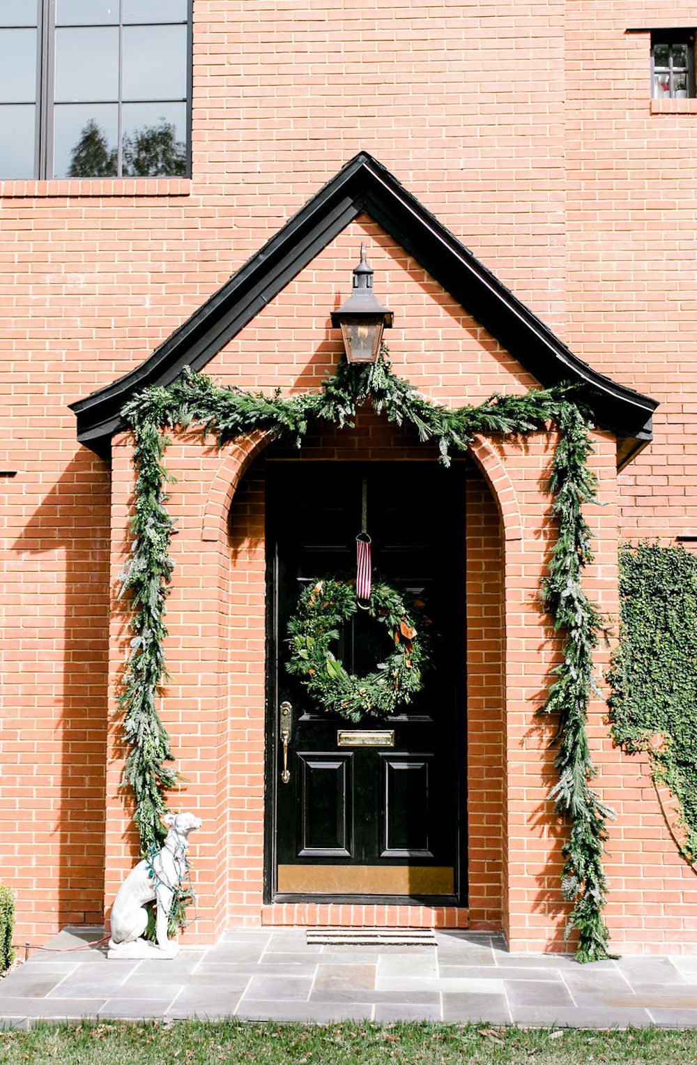 Classic brick home exterior decked out for the holidays