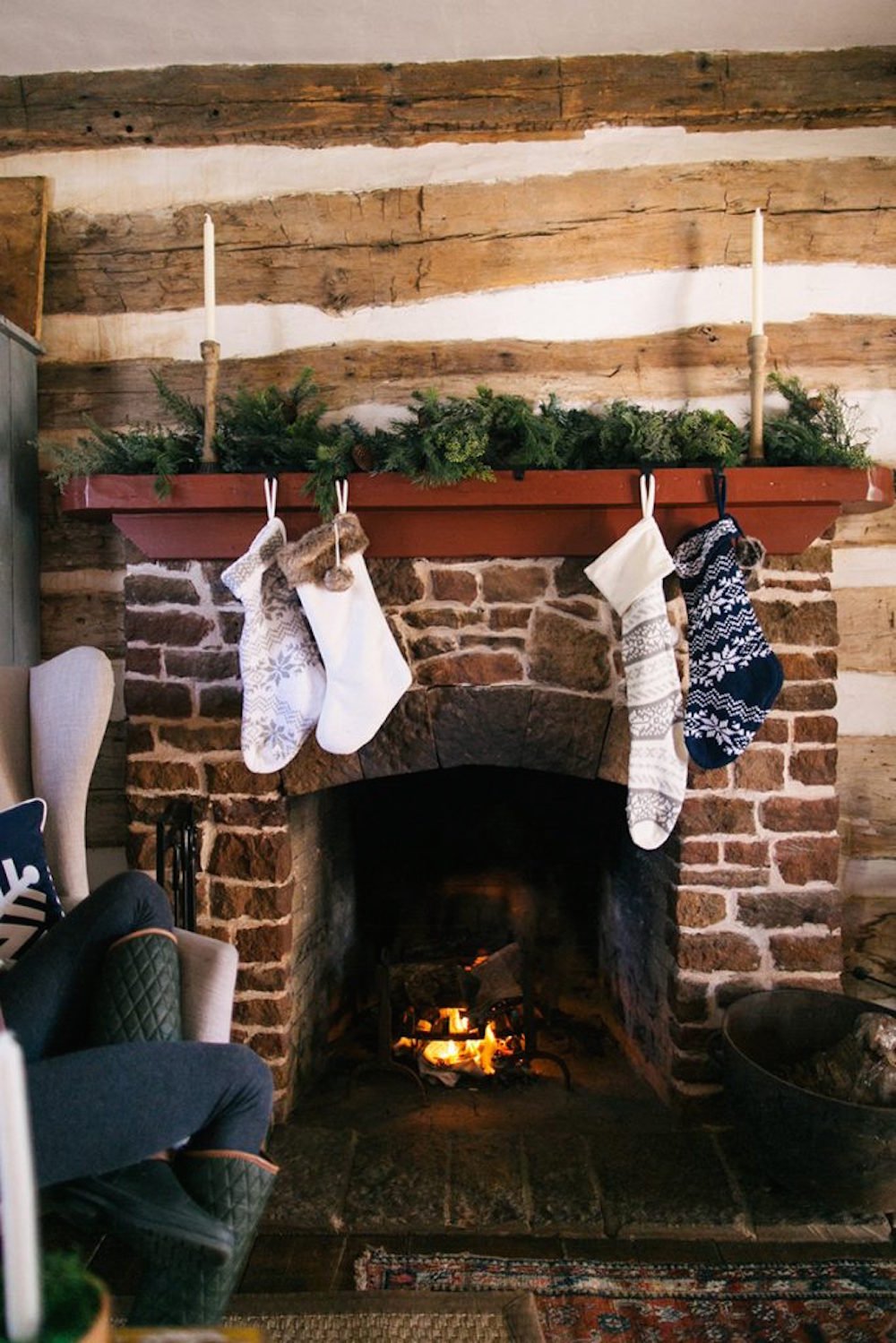 brick fireplace, christmas stockings hung on fireplace