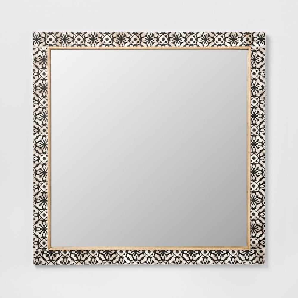 gorgeous white round mirror with tile frame detail