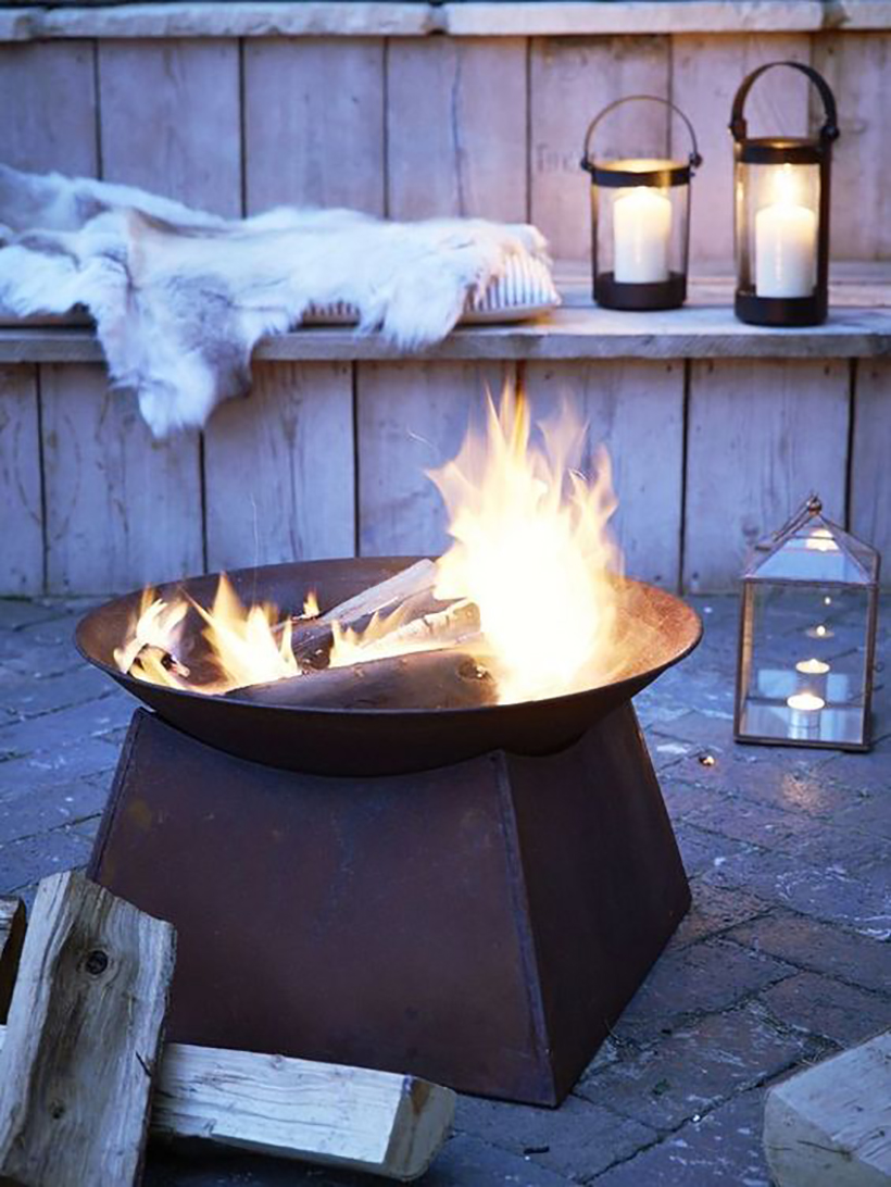 Sit around a backyard fire pit with friends.