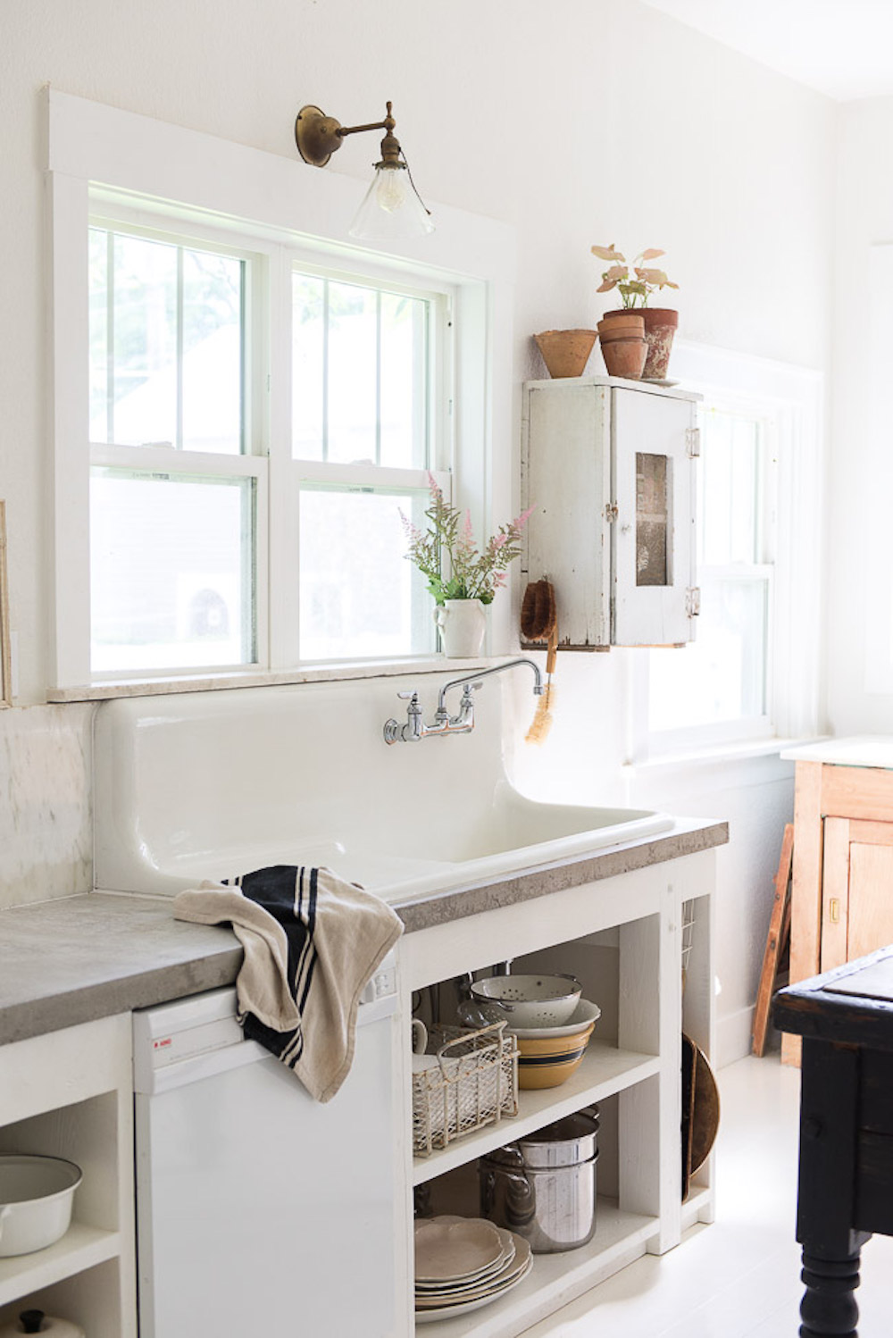 vintage sink with concrete countertops