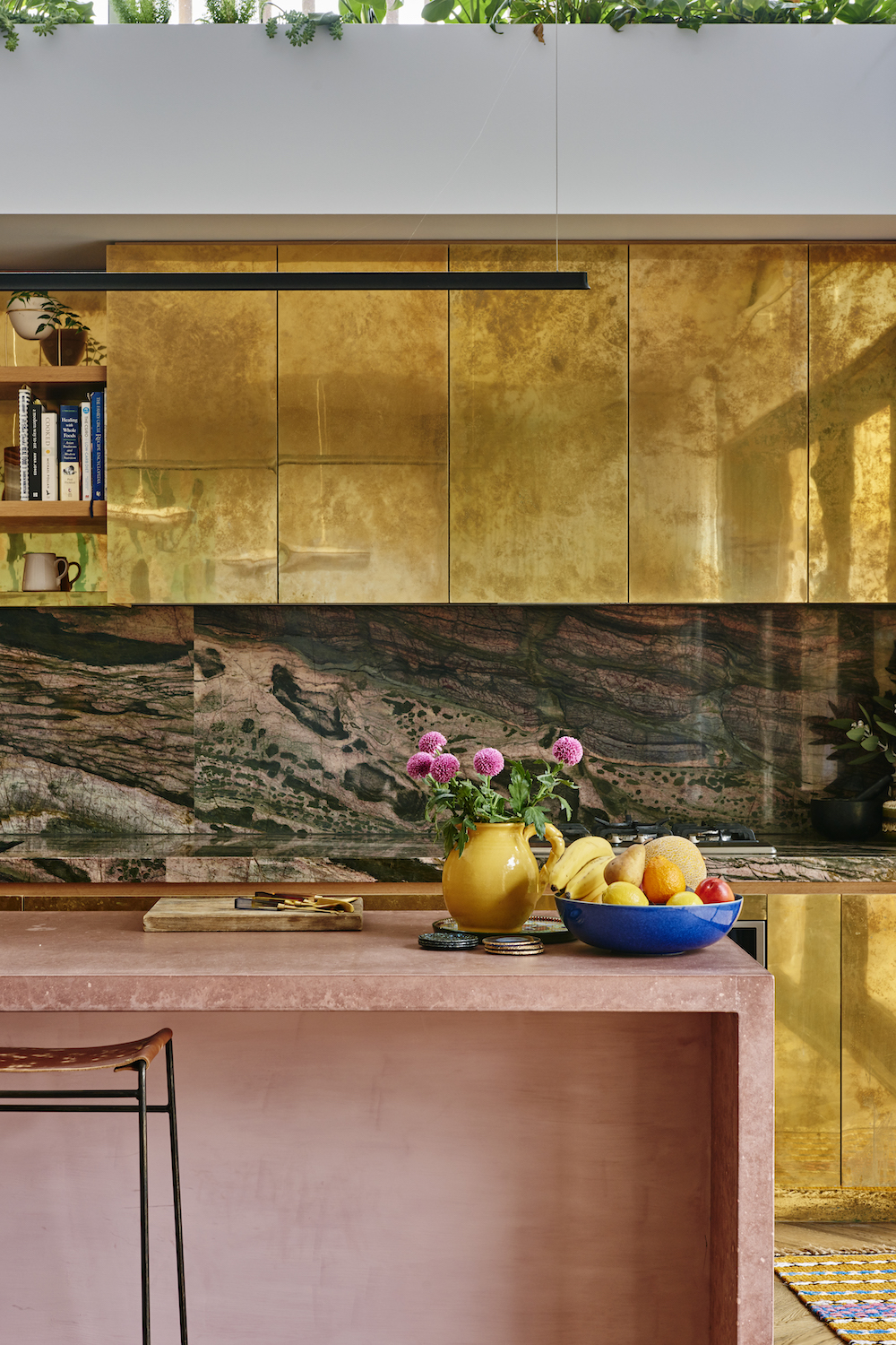 pink, brass and stone kitchen
