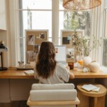 camille Styles working at desk