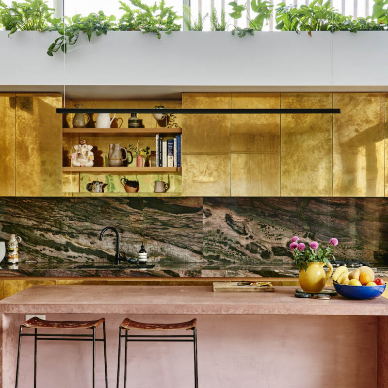 Alex Van Der Sluys's striking kitchen with stone, brass and pink