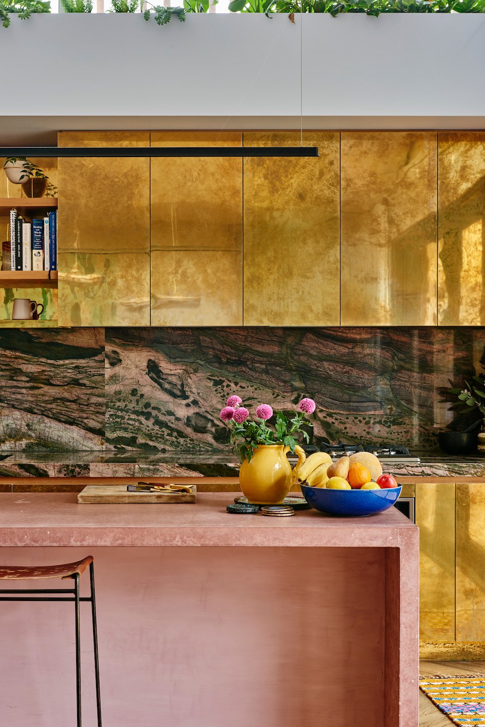 pink and gold stone kitchen
