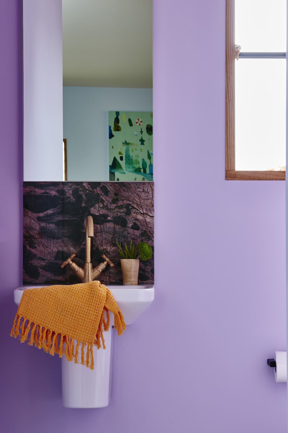cute powder room with purple walls