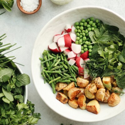 spring herbs and roasted potato salad with tahini green goddess dressing