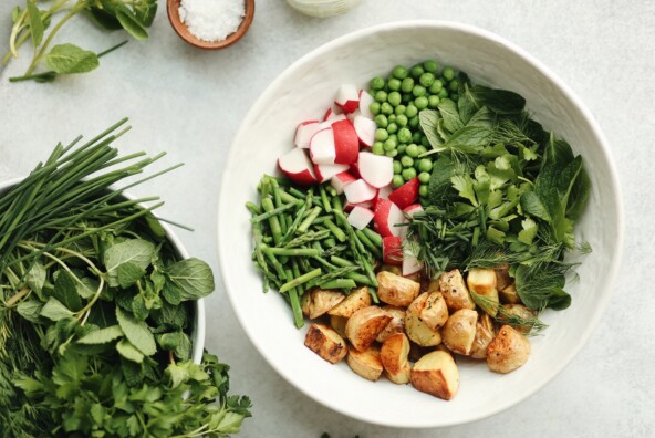 spring herbs and roasted potato salad with tahini green goddess dressing