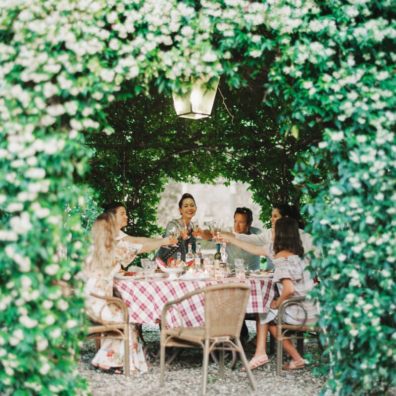 Beautiful dinner inside a jasmine covered gazebo in Lucca, Italy.