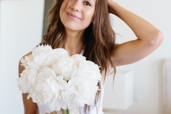 Camille Styles bedroom with white peonies