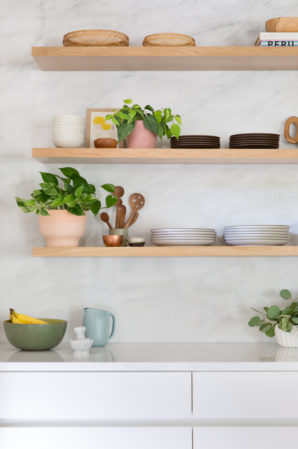 floating shelves with pretty modern dish wear