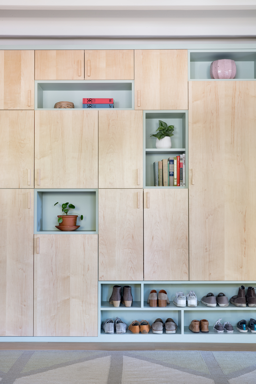 amazing built in wall of shelving and storage