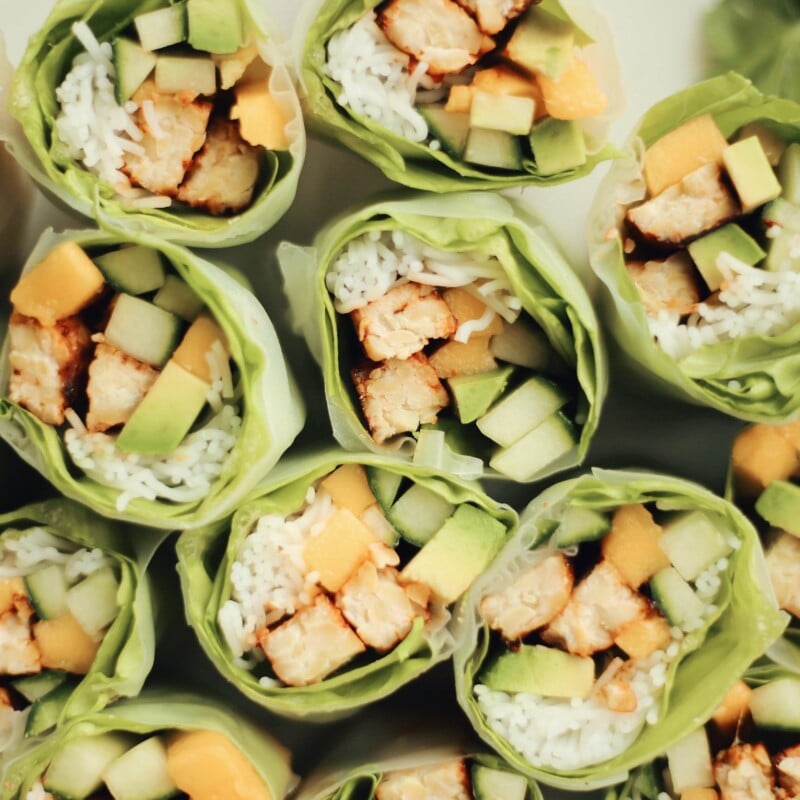 honey sriracha marinated tempeh rice noodle spring rolls with cucumber, mango, and avocado