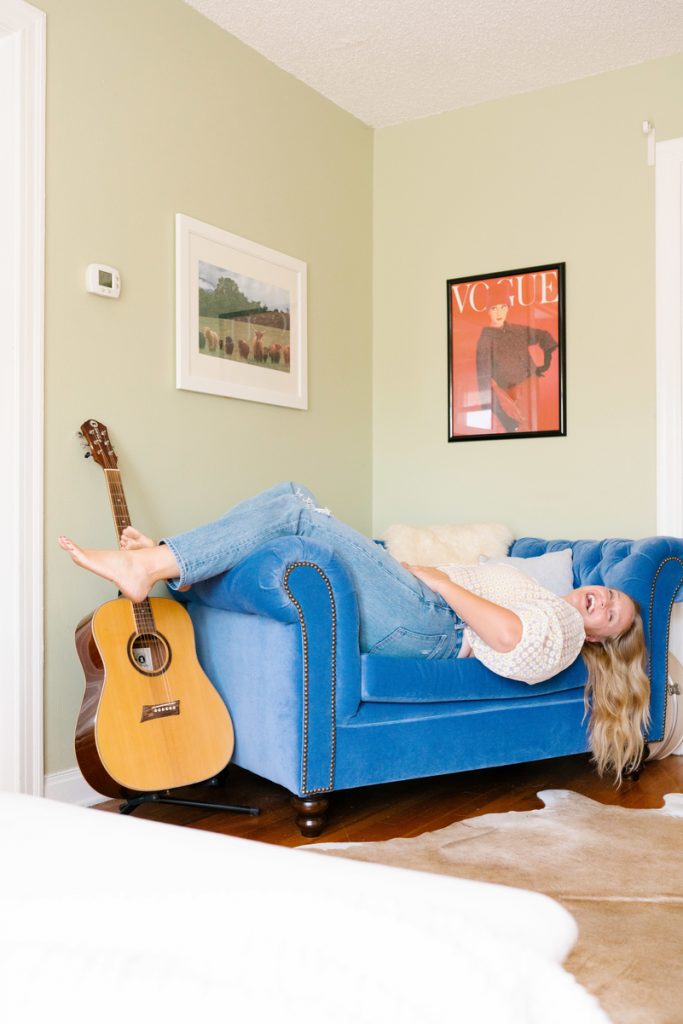 beth hitchcock at home, body positivity model, with guitar