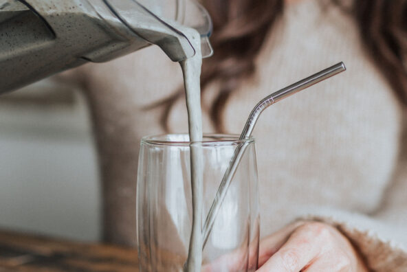 Kelly LeVeque pouring protein smoothie
