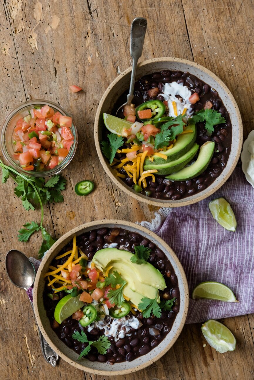 two bowls of easy black bean soup assembled