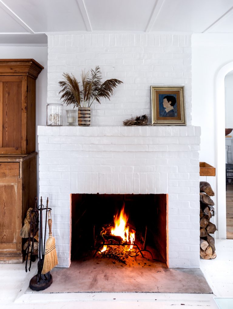 The Painted Brick Fireplace in Alex Bates's Fire Island Cottage