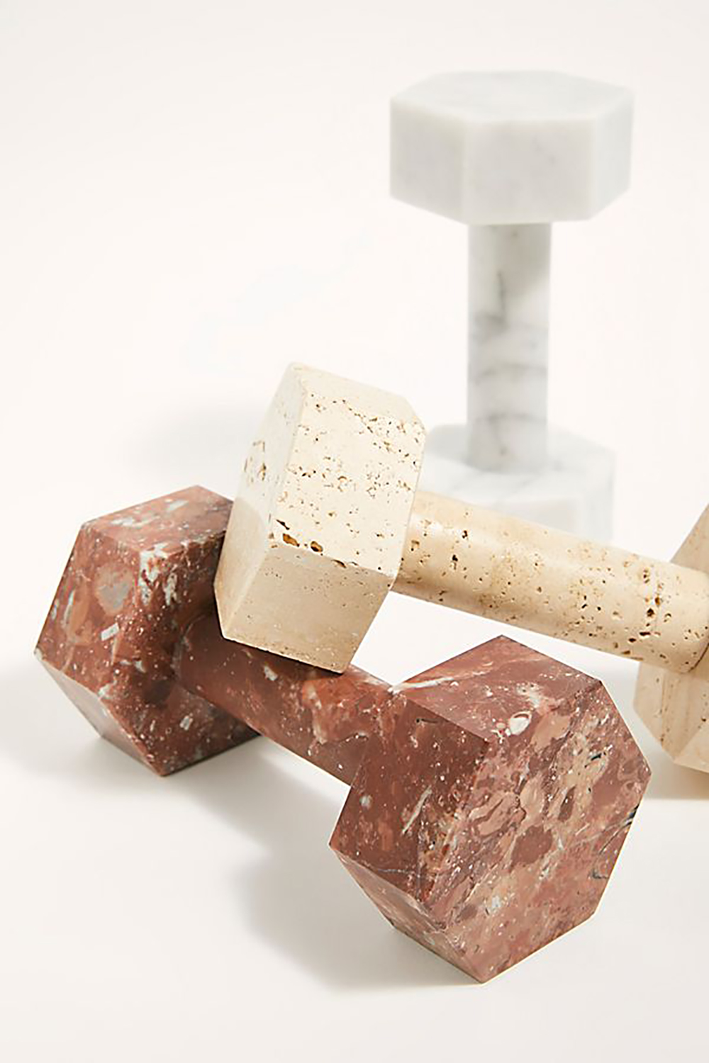 Page Thirty Three Marble Dumbbells Finally, workout gear that doesn't ugly up the living room. Whether you’re using them for a workout or as a unique decoration, these marble dumbbells are sleek, beautiful and functional.
