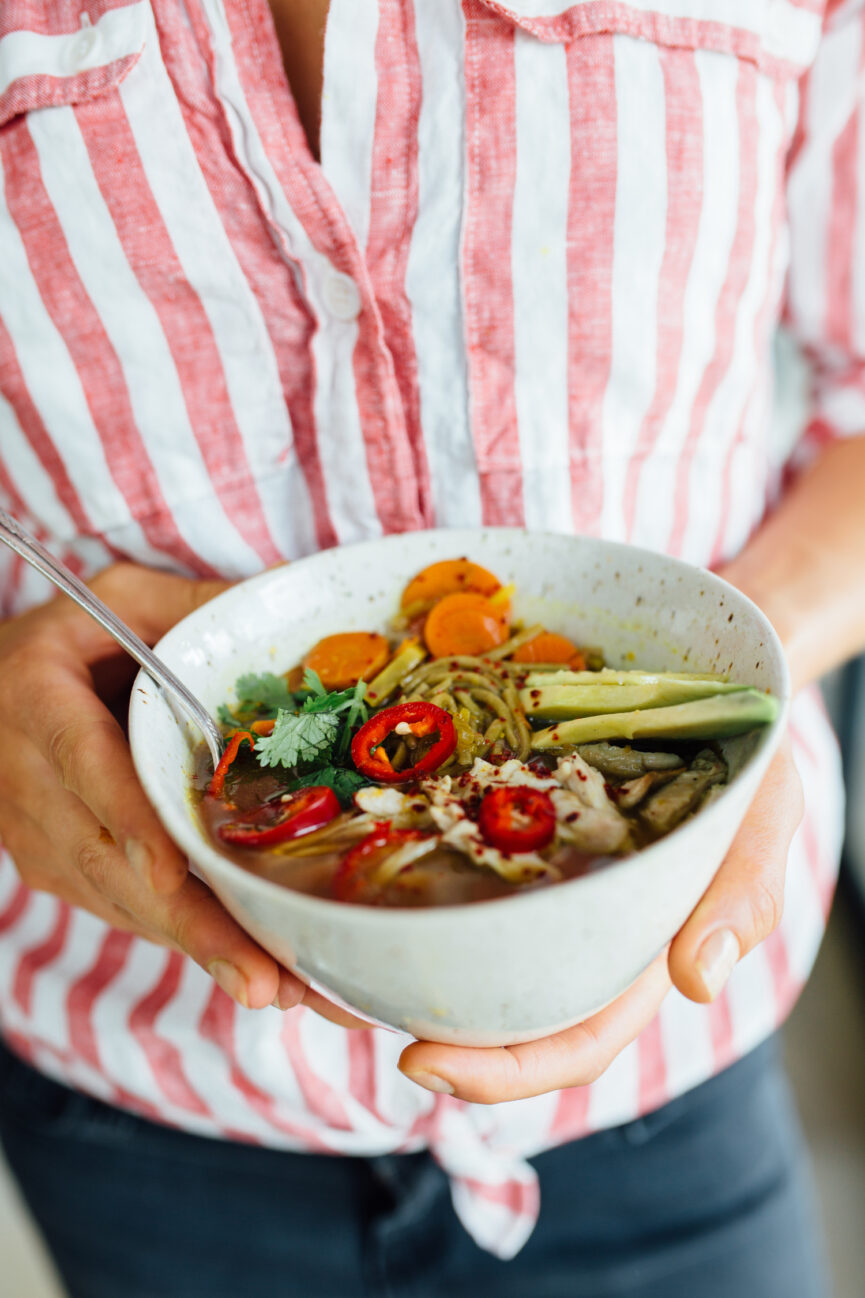 holding turmeric chicken immunity soup