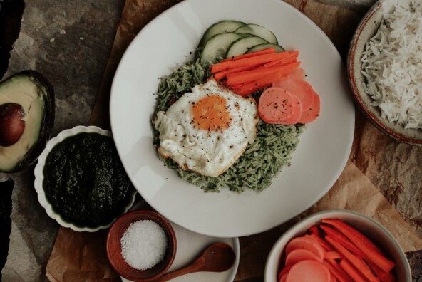 herby kale rice bowl with pickled veggies and a fried egg