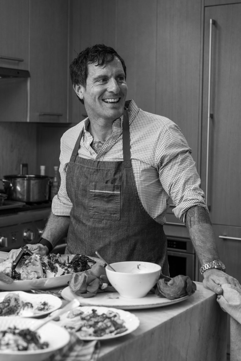 chef Seamus Mullen with whole roasted cauliflower in his home kitchen