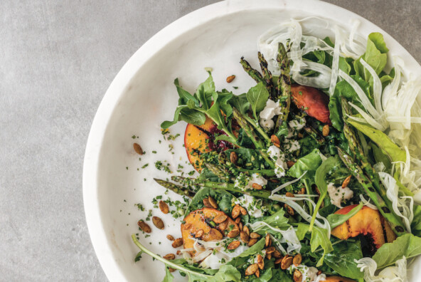 grilled peach and asparagus salad with spicy pepitas and cashew mozzarella, from cafe gratitude