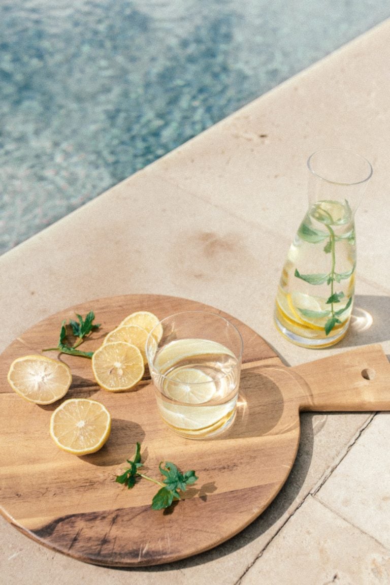 lemon-infused water next to a pool_best foods with electrolytes