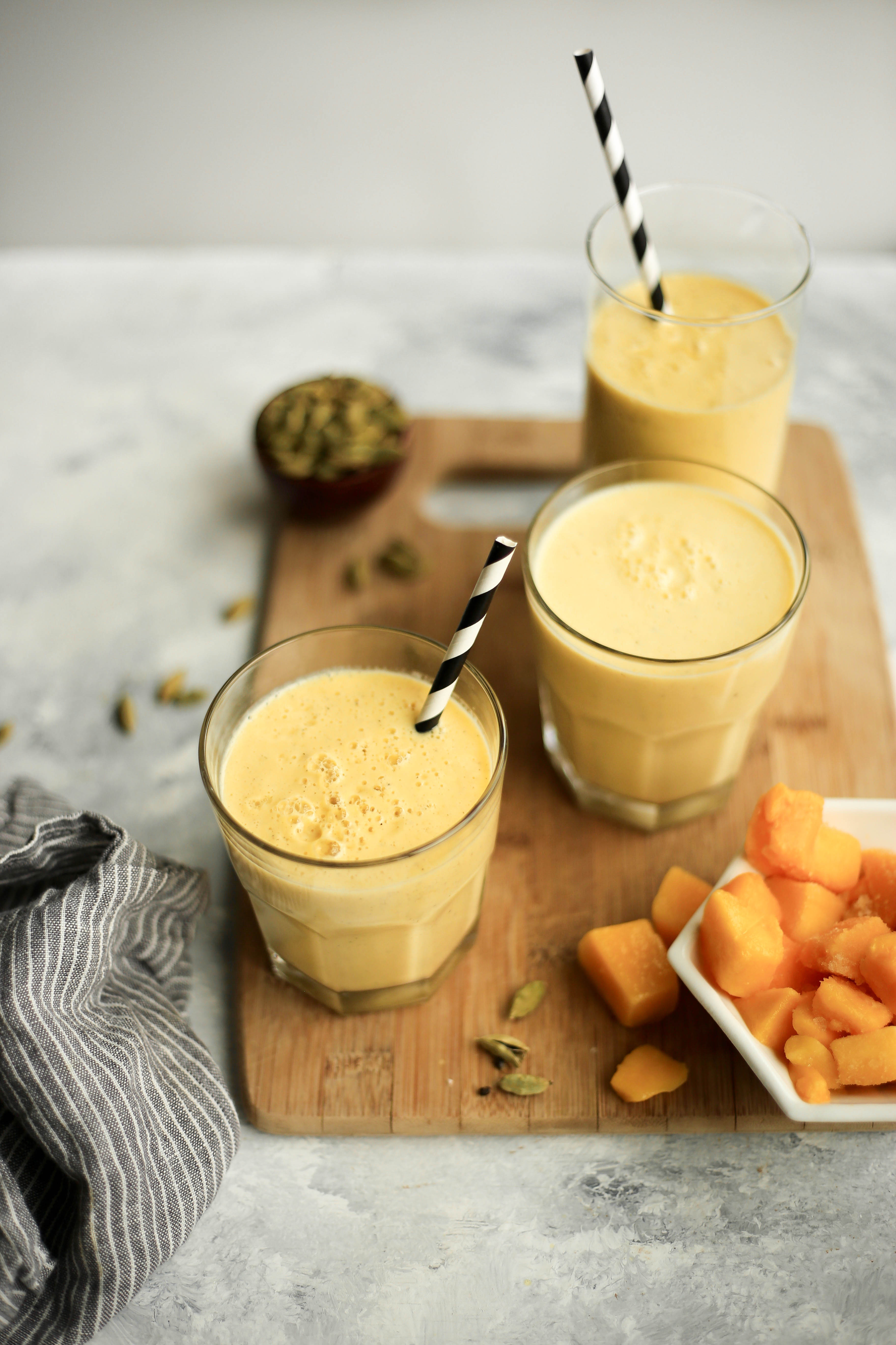 salty mango lassi - a refreshing summer drink with mango, black salt, yogurt, and cardamom